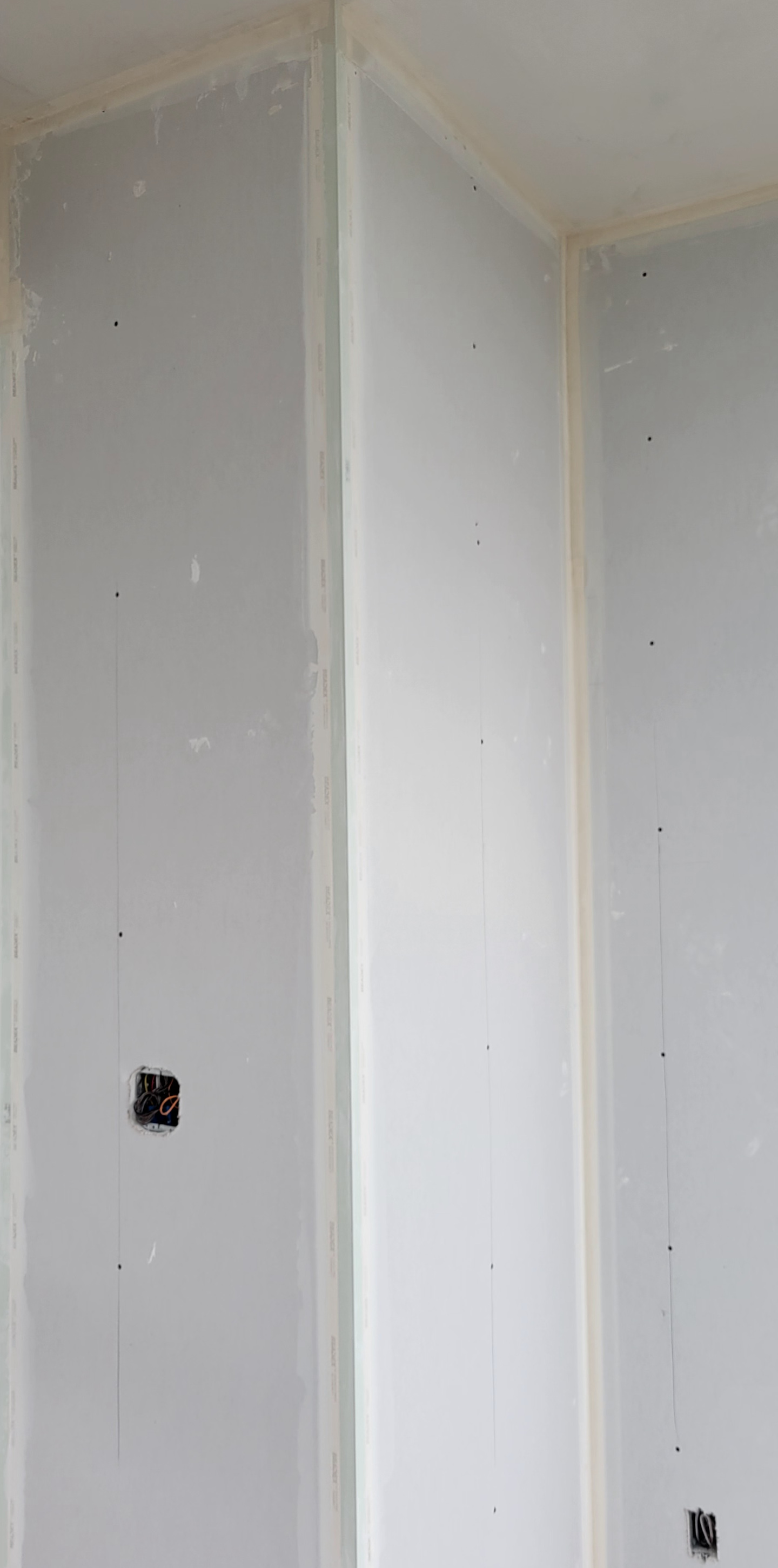 A closeup of drywall installation result.