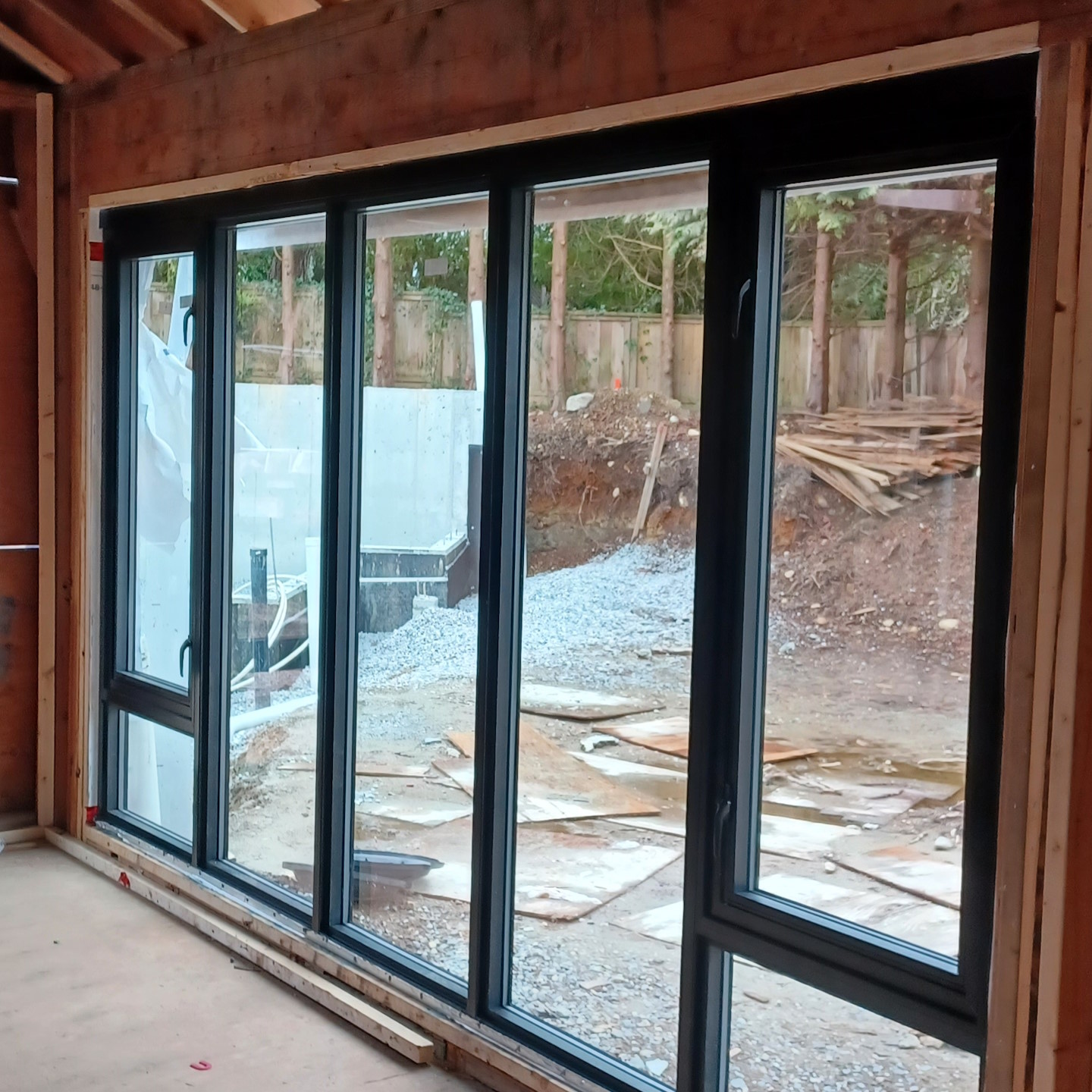 A large recently-installed seven-part window in a newly-constructed building.