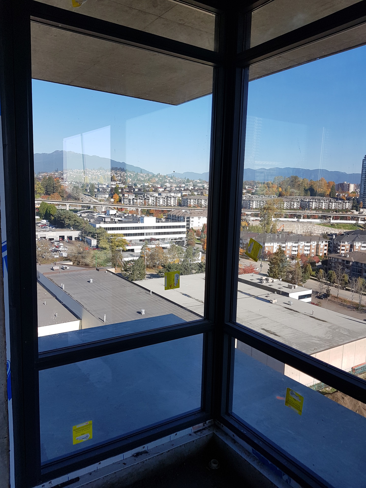 A freshly-installed set of apartment corner windows.
