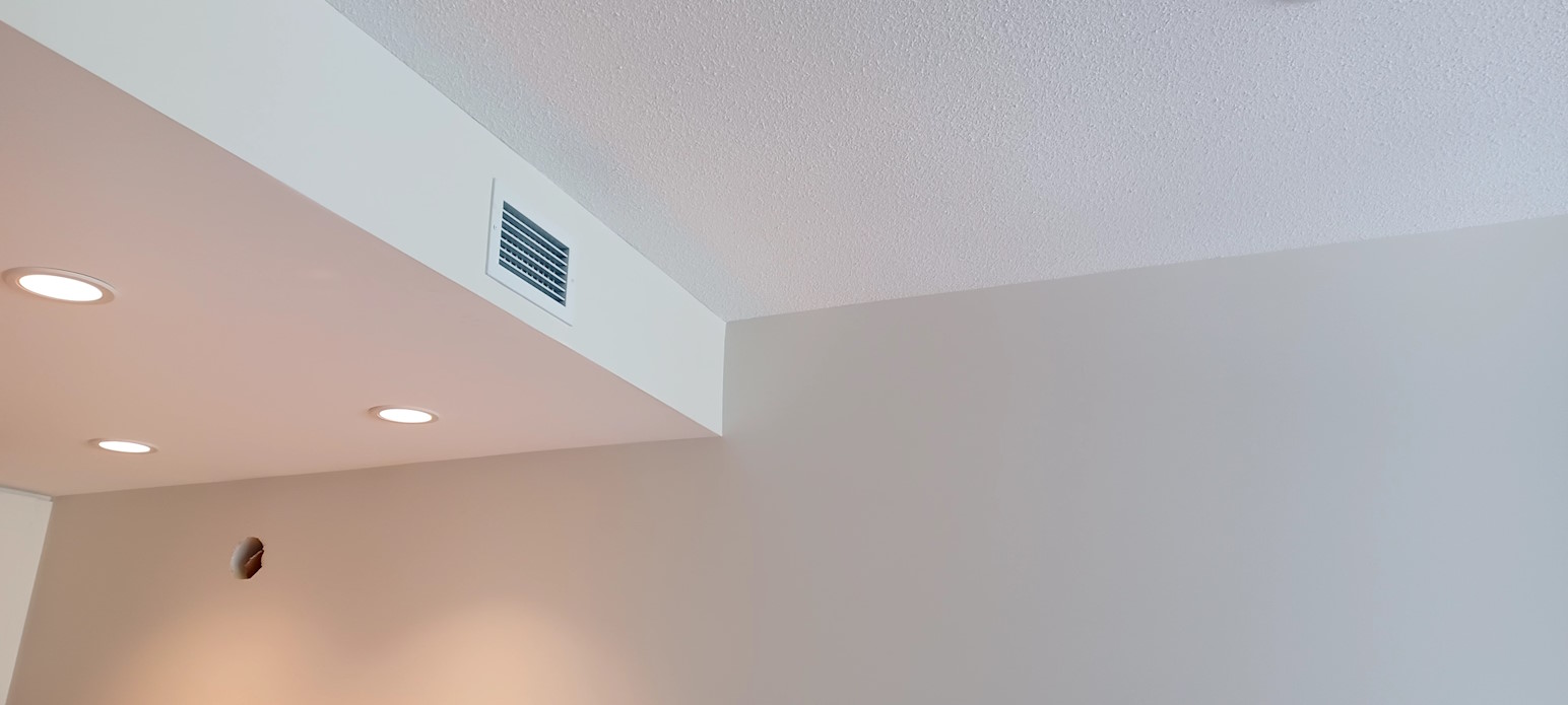 A painted kitchen wall and ceiling.