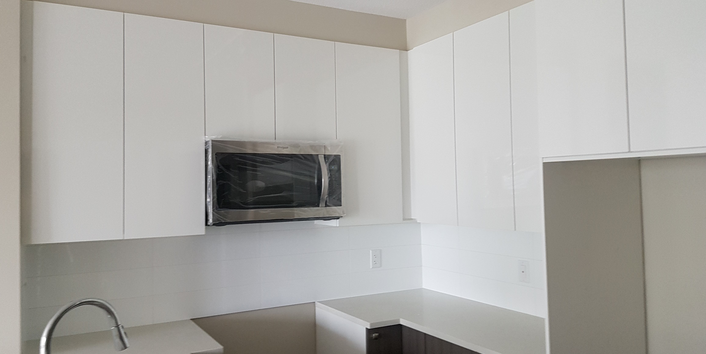 Shiny new kitchen cabinets.
