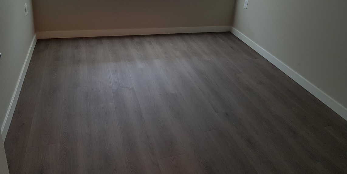 Installed bedroom hardwood flooring.