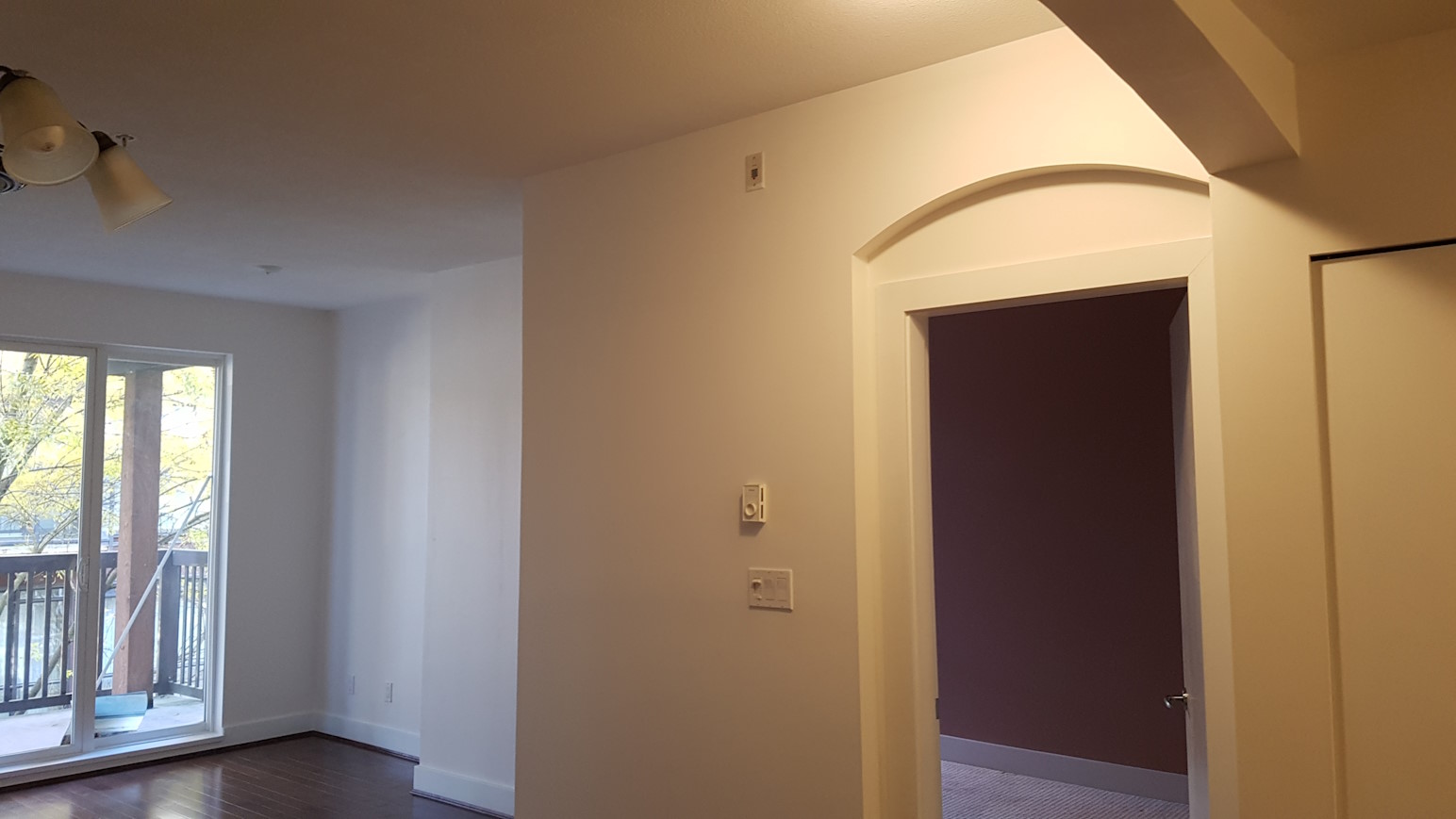 A renovated living room, with newly-painted walls.