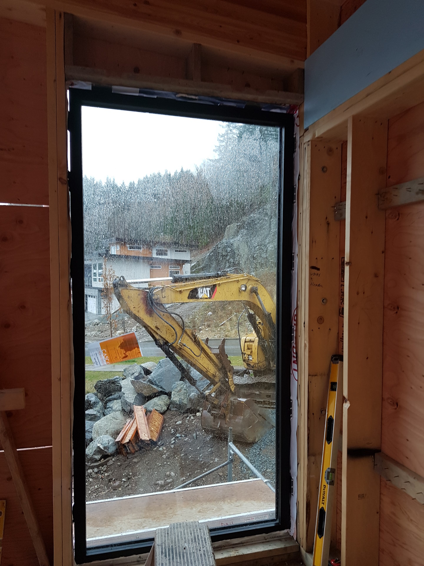An installed window in a newly-constructed house.