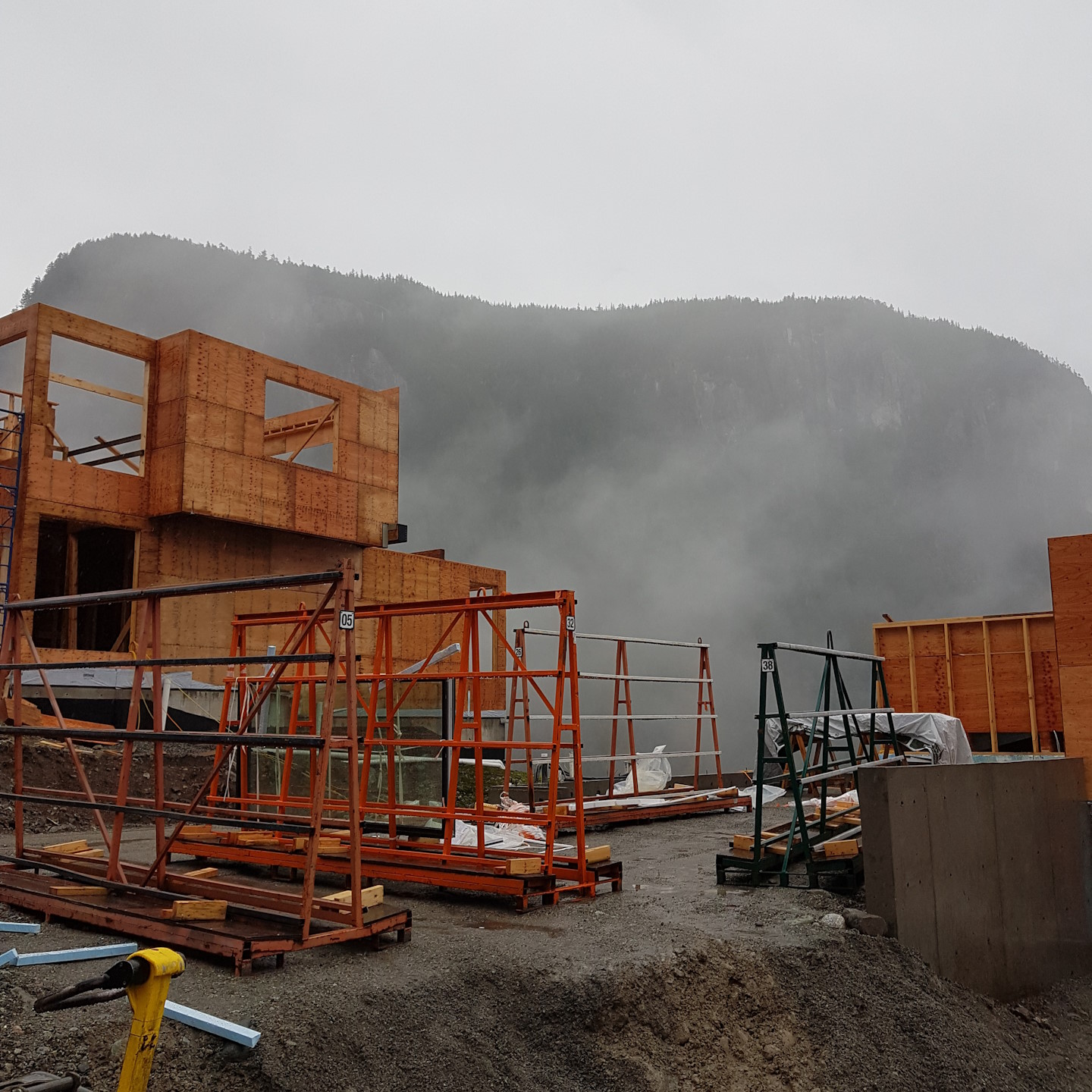 Two houses under construction in a window installation job.