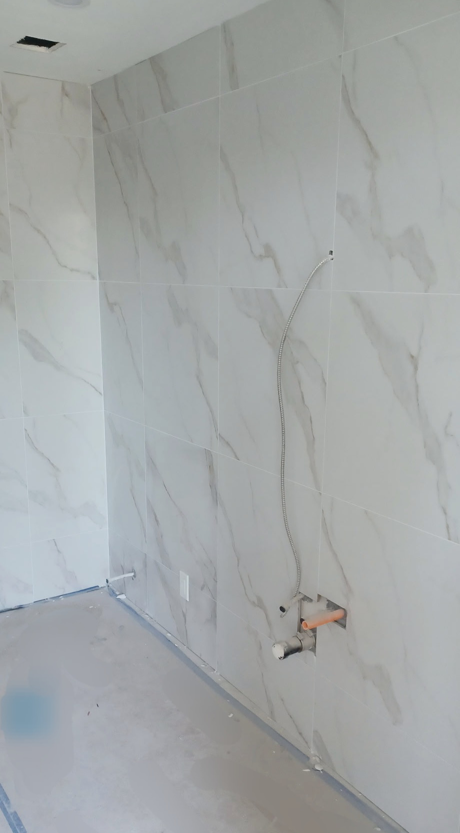 A newly-installed marbel tile wall.