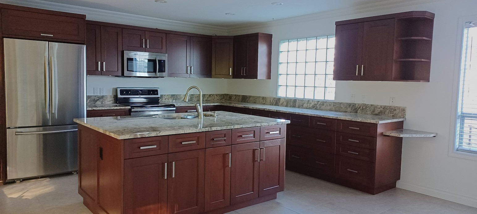 A kitchen after renovation, with newly-painted walls.